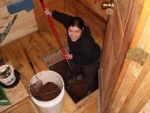 Autumn Cutting, Agape Intern, happily changing the compost bins