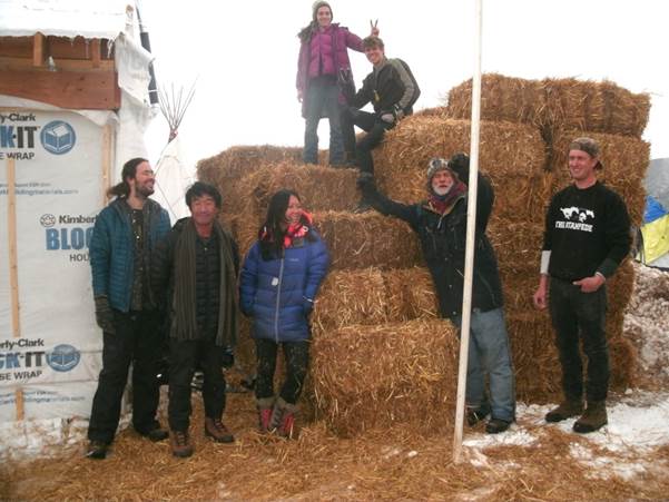 Nelia, Tim and Brayton arriving at Oceti Sakowin Camp with straw bales